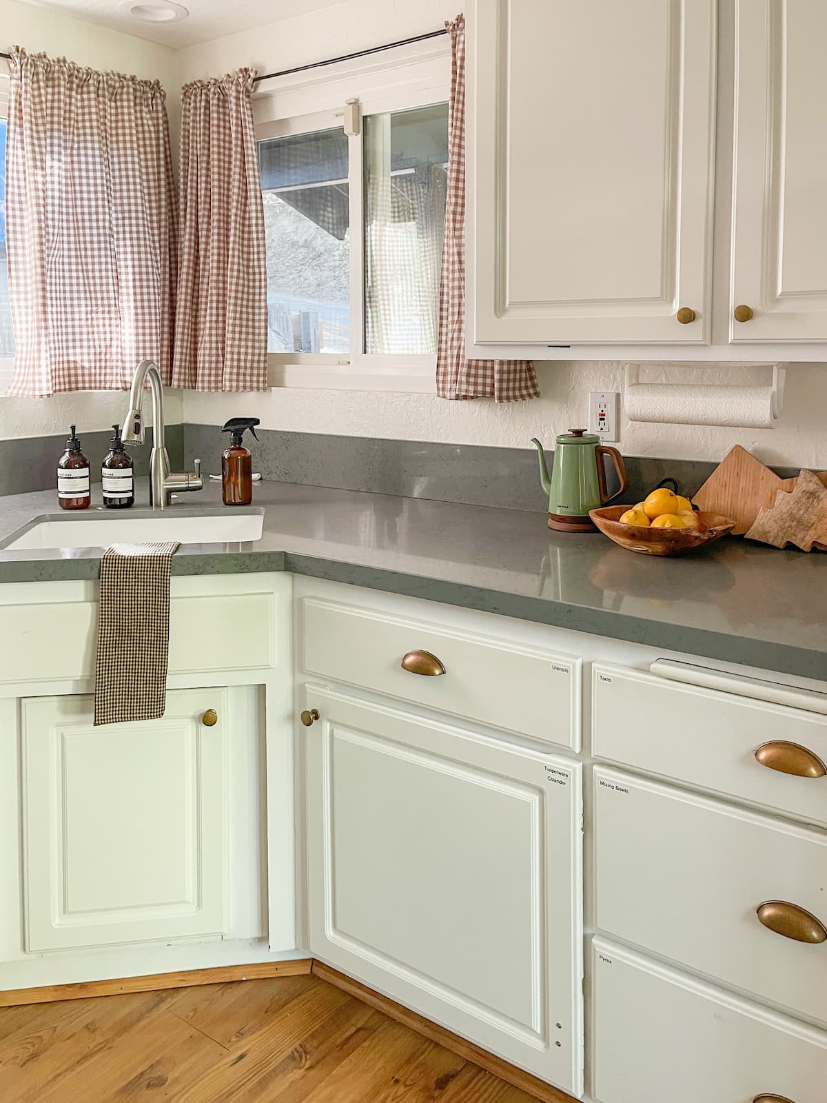 Kitchen counter with gingham curtains